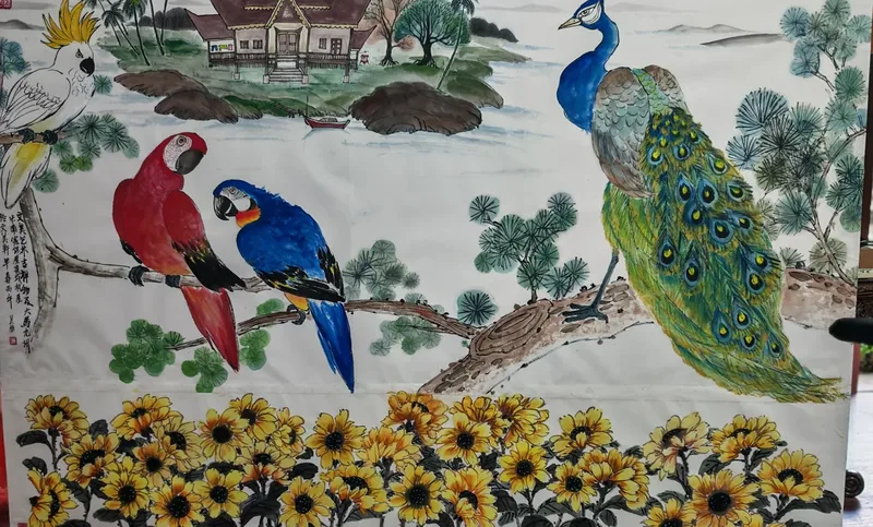 Ink painting: macaws and a cockatoo on a branch, a peacock, sunflowers and a house by the water